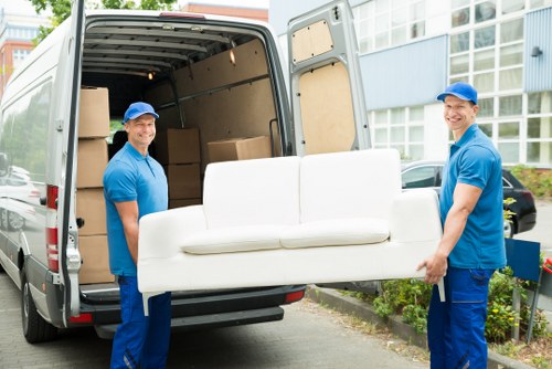 Local London removals team handling a residential move in a city street