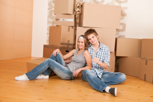 Unpacking boxes and arranging rooms in a London home after moving