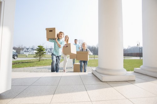 House movers helping with a London home move on a busy street