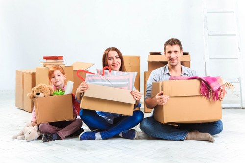 Packed office equipment and labelled boxes prepared for relocation in London