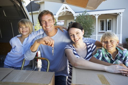 Professional movers handling furniture during a London move
