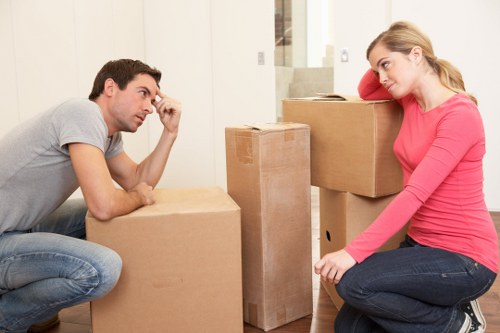 Movers loading furniture into a truck in London